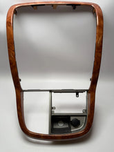 Oryginalna osłona konsoli środkowej KIA CARNIVAL II - orzech włoski 0K53A64320