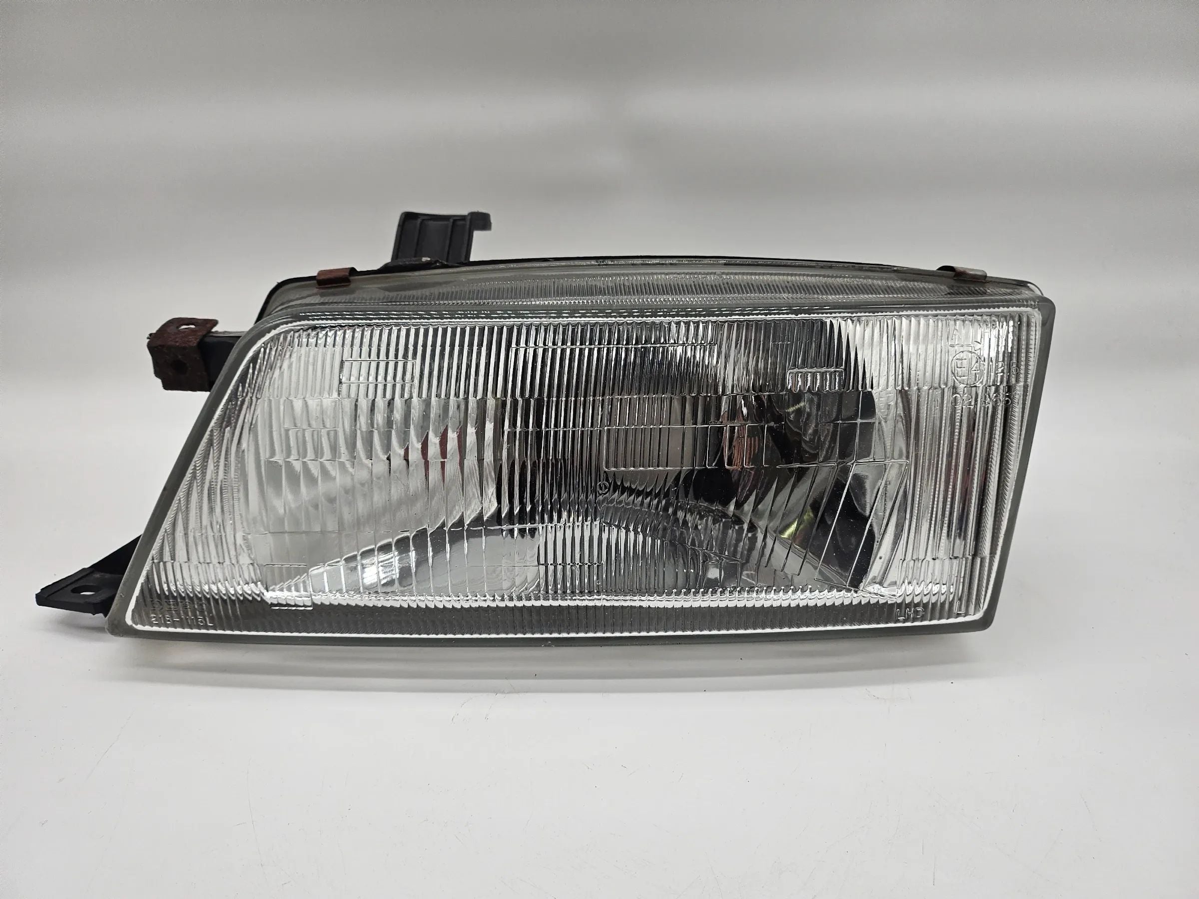Headlight left Suzuki EG Baleno 1.3 with LWR