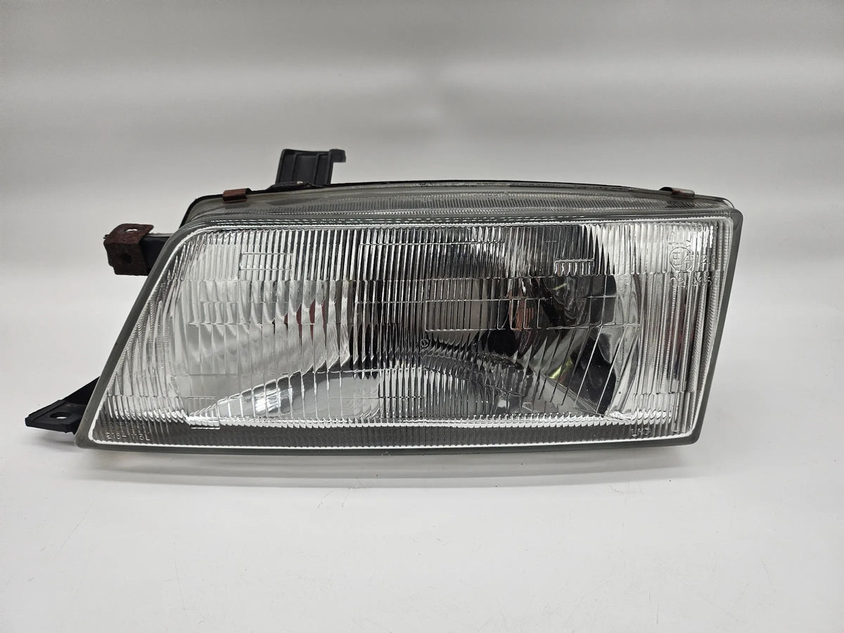 Headlight left Suzuki EG Baleno 1.3 with LWR