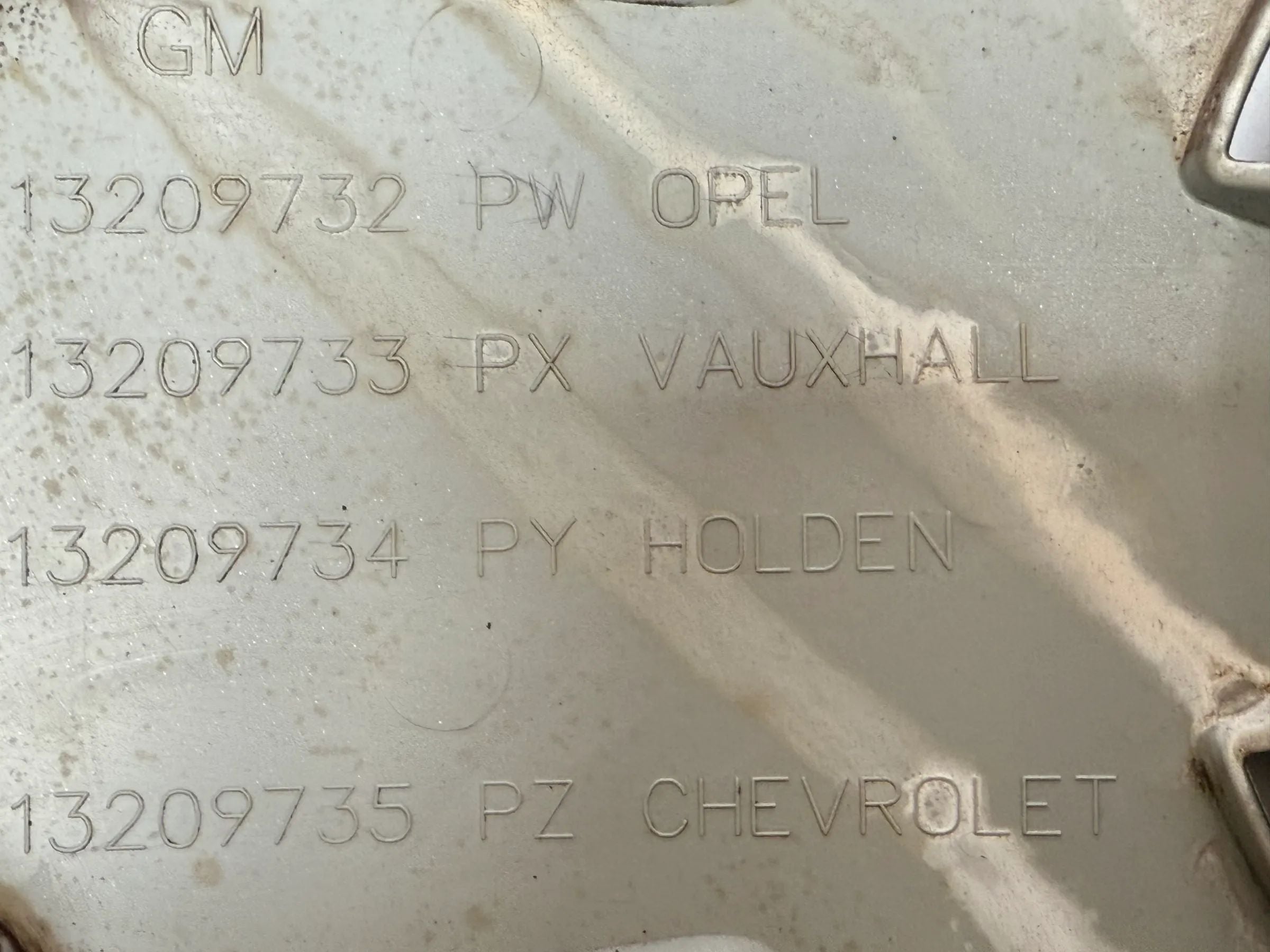 Oryginalna zaślepka koła Opel Astra H / Zafira B 16 cali 13209732