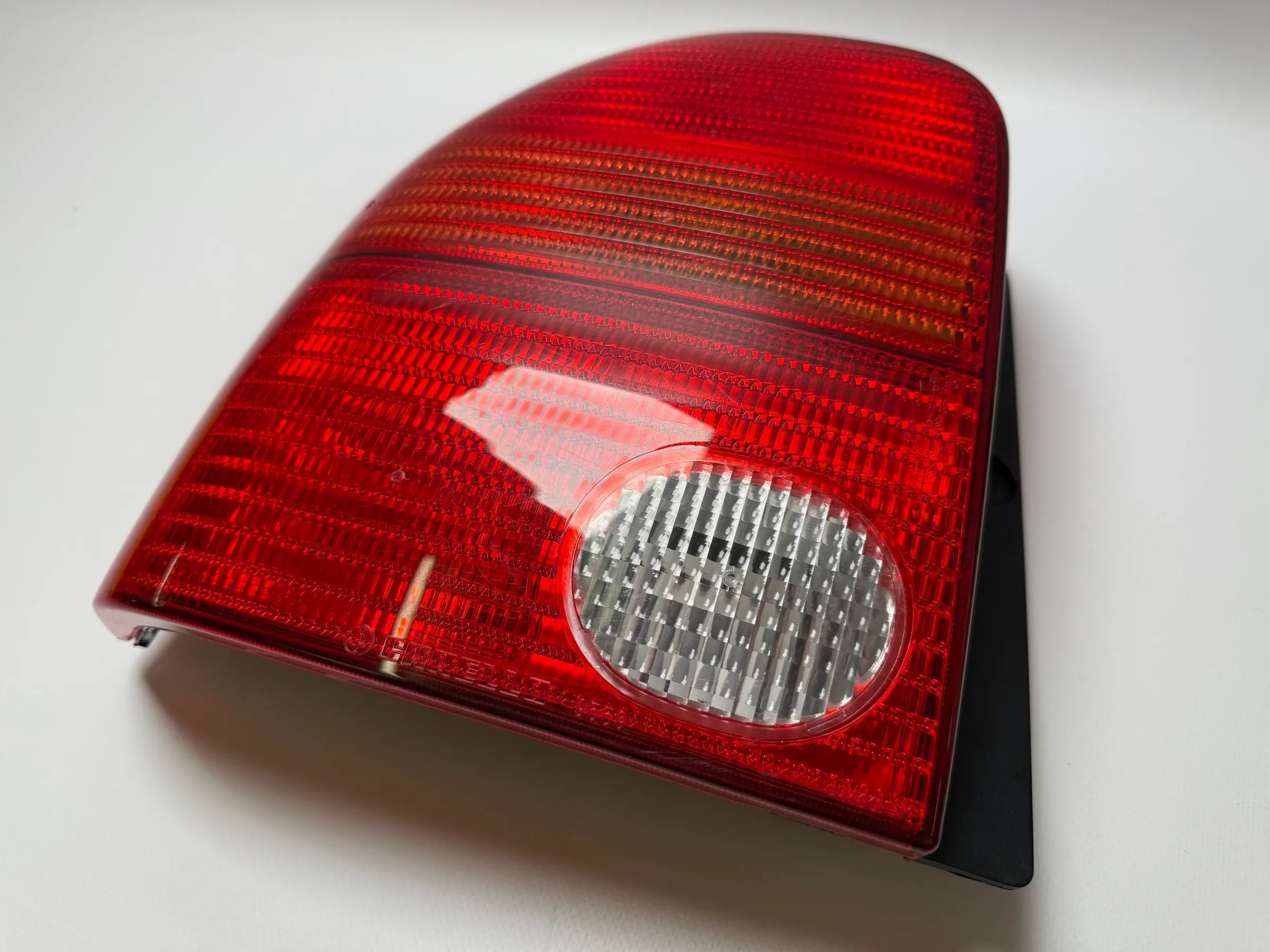 Oryginalna lampa tylna VW Lupo 6E1,/6X1 lewa, Carello 38030748 / 9559