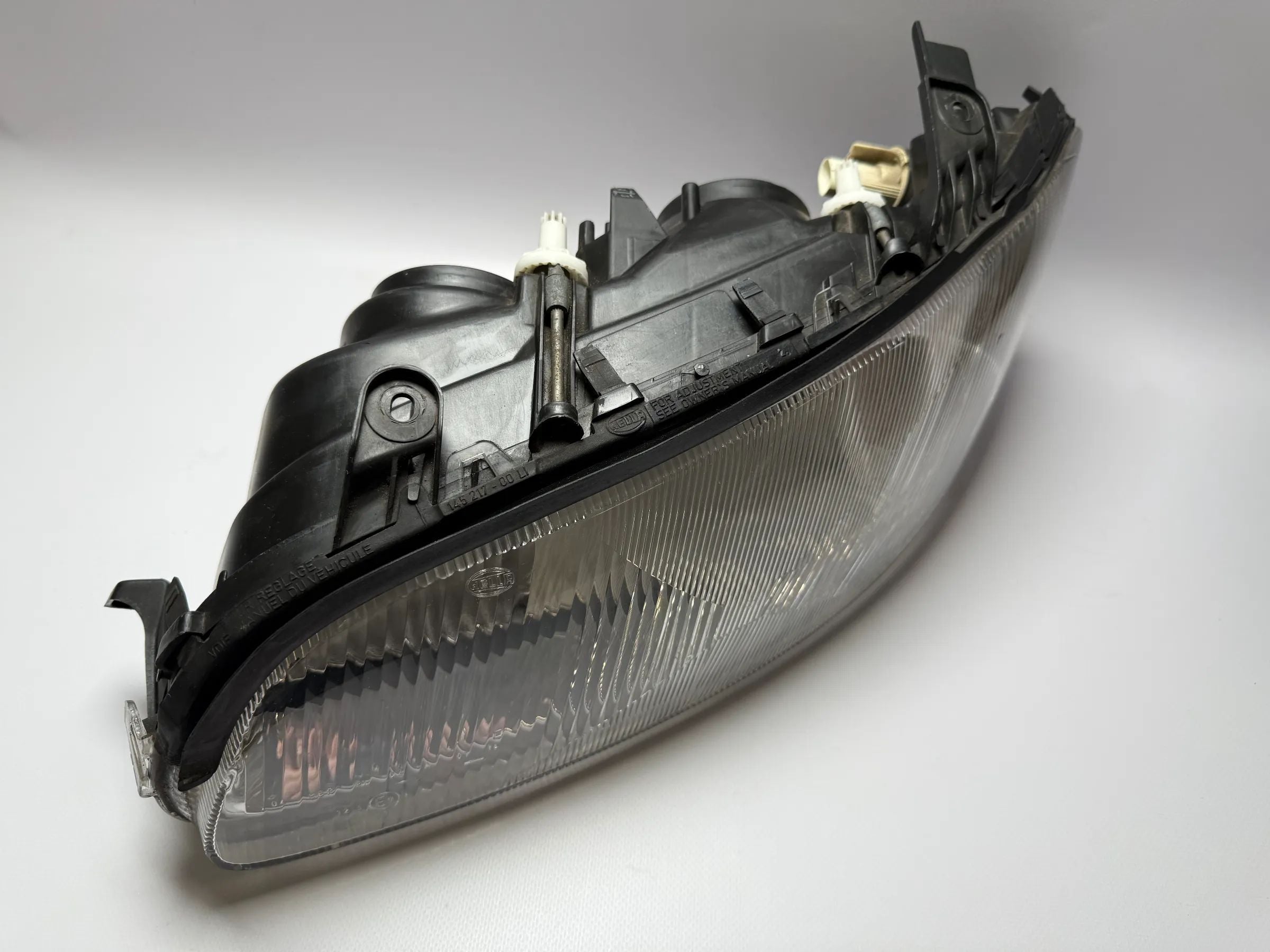 Ópticas dianteiras principais originais Opel Omega B1 1998 com ajuste faróis à esquerda Hella 15443500